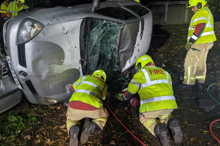 Team members working on a simulated traffic accident. Photo: Mid & West Wales Fire & Rescue Service