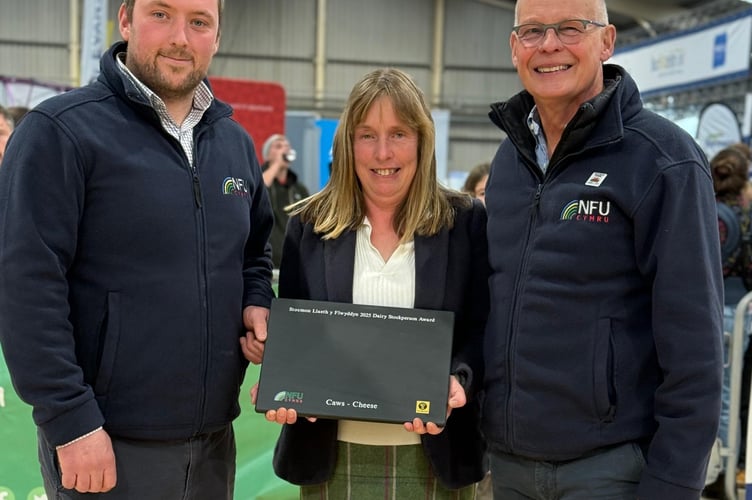 NFU Cymru Dairy Board Chairman Jonathan Wilkinson, NFU Cymru / NFU Mutual Dairy Stockperson of the Year Award winner for 2025, Kathryn Joules and NFU Cymru / NFU Mutual Group Secretary, Rhys Williams