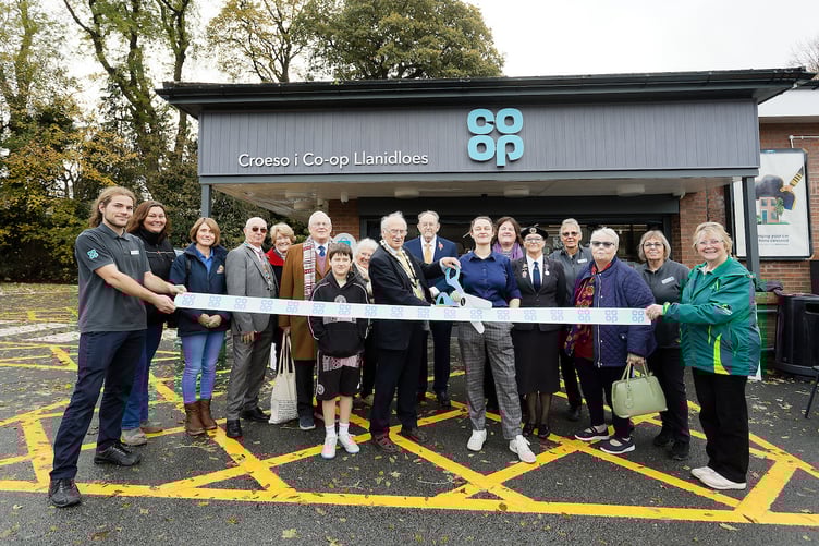 Mayor Dr John Hughes and store manager Sophie Brunt cut the ribbon, joined by local residents and dignitaries. Photo: © Dimitris Legakis