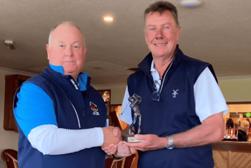 Harri Jones presents thre trophy to Dai Bader