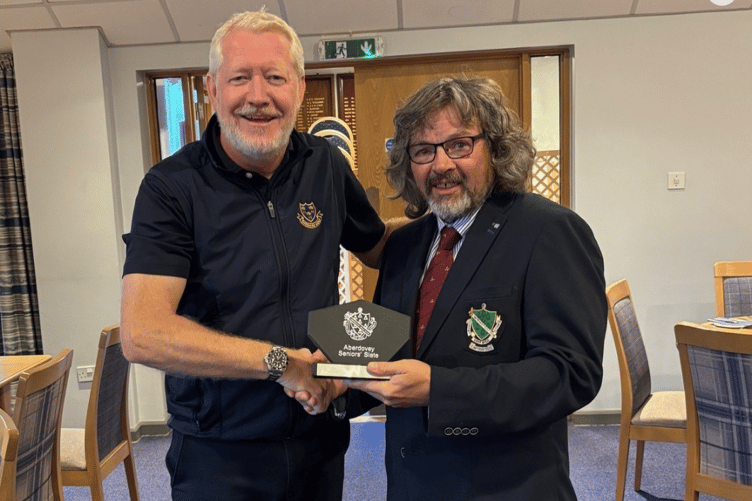 Dave Williams presents the trophy to Mike Wallwork