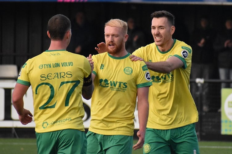 Sion Bradley is congratulated after scoring one of his two penalties against Briton Ferry Llansawel