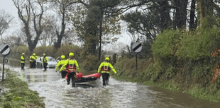 Warning to drivers after two rescued from floodwater