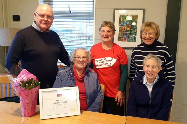 Lena Pritchard was presented with her award by Llinos Roberts, Engagement and Fundraising Officer for Christian Aid Church, Rev Bryn Williams, Treasurer Daphne Jones, Treasurer and Valerie Williams, the Pwllheli branch’s new organiser