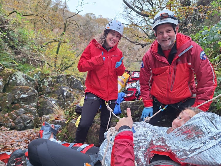 Rescued woman manages a smile and a thumbs up for the camera as South Snowdonia Search and Rescue Team picture shows