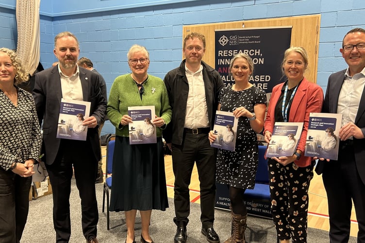 From left, Sally Hore Head of Research and Development; Professor Leighton Phillips, Director of Research, Innovation and Value; Professor Sue Denman, Dr Will Macintosh, Dr Anna Collenette, Professor Helen Munro and Hywel Dda's Medical Director, Mr Mark Henwood