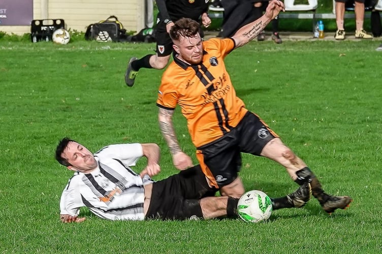 Talybont's Aled Parry-Evans and Anthony Wyn Evans compete for the ball
