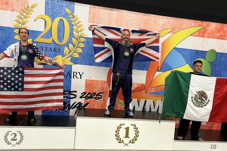 Gold medal winner Dan Cooke on the podium