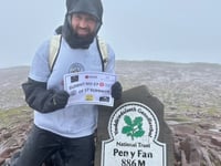 Soldier battles horizontal wind and rain on Pen y Fan in memory of nan