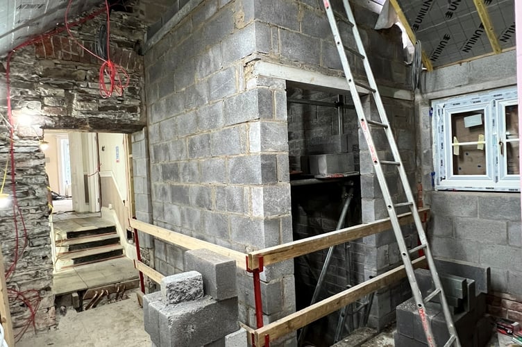 The lift shaft on the first floor and new roof area