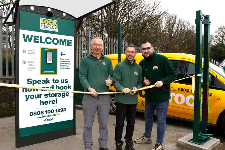Lock Stock’s Rob Jones, left, and Commercial Manager Ollie Beech watch as West Wales Regional Manager Lee Hanson cuts the ribbon on their new Aberystwyth site. Photo: Phill Davies.
