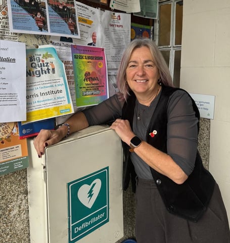 Liz Saville Roberts MP with a community defibrillator at the Institute, Corris