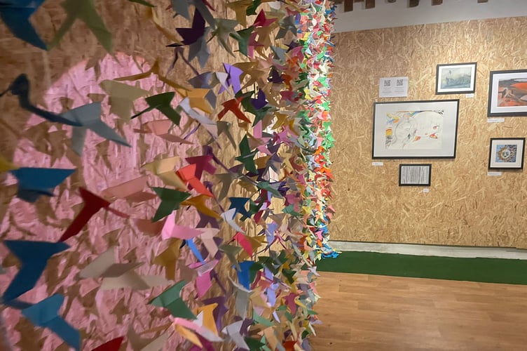 The installation piece ‘A Thousand Paper Birds: Honouring Palestinian Lives’, is also