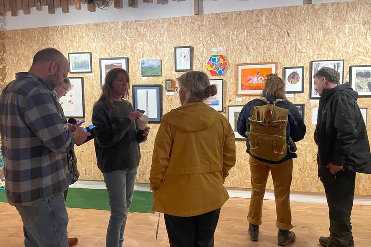 Visitors at the opening of the exhibition in early November at Oriel Sploj Art Gallery in Machynlleth. Photo: Ennyn Cymru/ Sploj