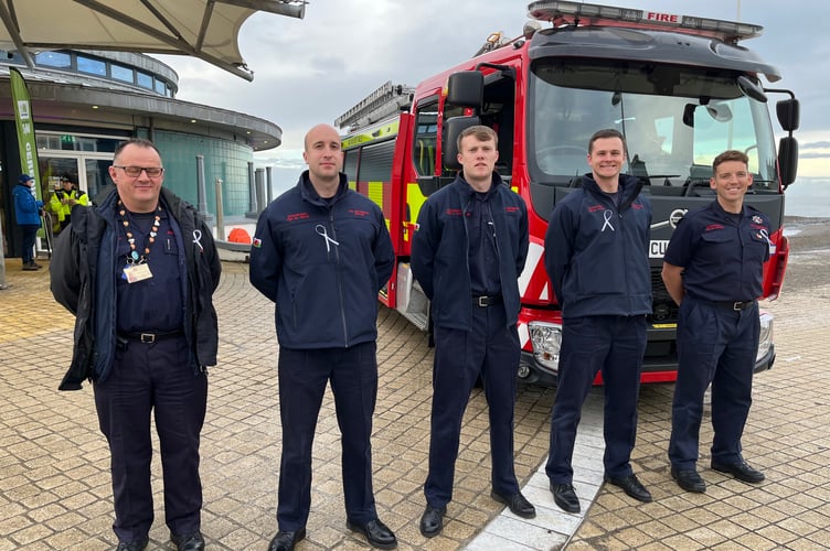 Team members from Aberystwyth Fire Station at the White Ribbon Day event. Photo: WWDAS