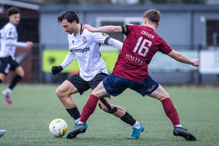 BALA, WALES - 29TH NOVEMBER 2025: Bala Town's Jacob Tarasenko and Cardiff Met's CJ Craven battle for the ball during the JD Cymru Premier fixture between Bala Town and Cardiff Met at Maes Tegid, Bala. 29th of November, Bala, Wales (Pic by Nik Mesney/FAW)