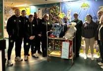 Gifts and smiles: Caernarfon FC visits children's ward