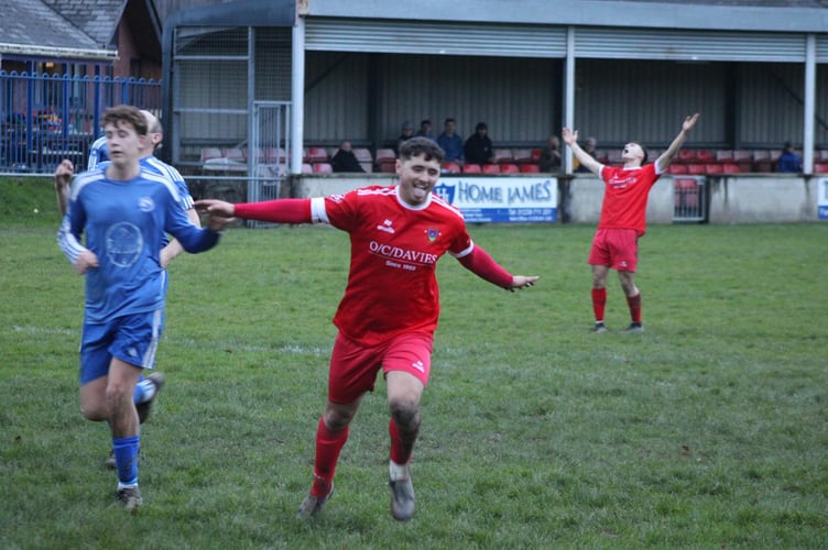 Osian Jones celebrates his late goal for Newcastle Emlyn