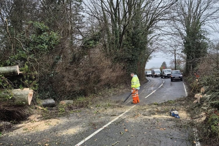 'Not all heroes wear capes': a worker clearing the road at Talsarn. Photo: Josh Lewes