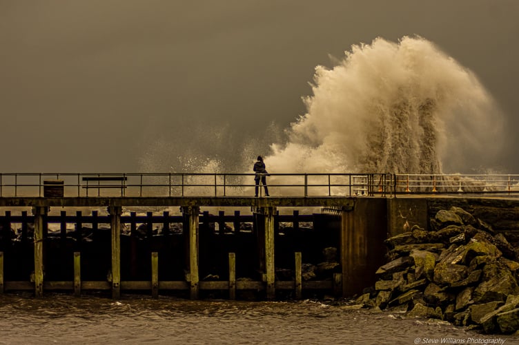 Waves breaching the sea defences at Tanybwlch beach in Aberystwyth during Storm Bram. Photo: Steve Williams Photography