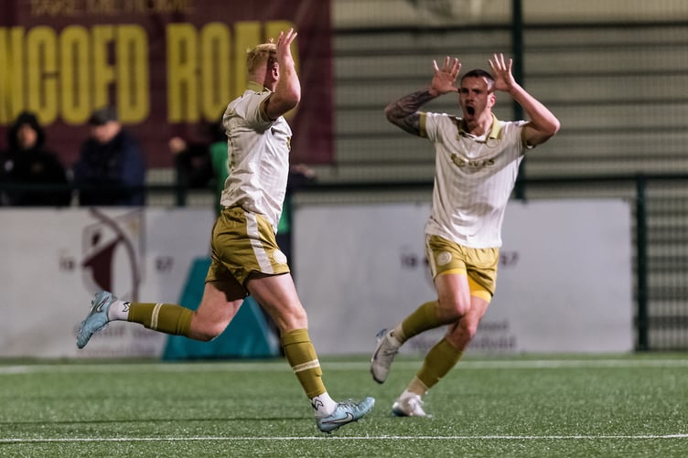CARDIFF, WALES - 13 DECEMBER 2025: Caernarfon Town's Sion Bradley scores and celebrates 0-1 during the 2025/26 JD Welsh Cup fixture between Cardiff Met FC & Caernarfon Town FC at Cyncoed Stadium, Cardiff, Wales (Pic by John Smith/FAW)