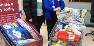 Supermarket donates three trolleys of toys to local charity