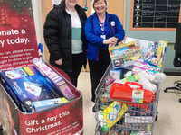 Supermarket donates three trolleys of toys to local charity