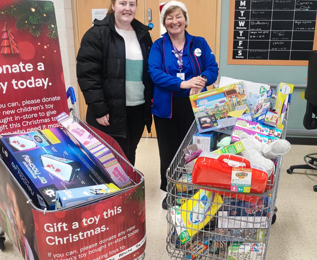 Supermarket donates three trolleys of toys to local charity