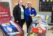 Supermarket donates three trolleys of toys to local charity