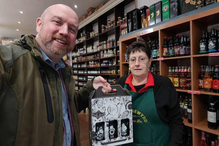 Mabon ap Gwynfor with Y Deli Newydd on Cricieth High Street