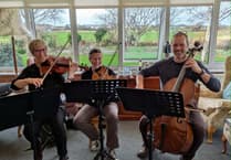 Totaleigh Music Trio brings Christmas cheer to Tywyn care homes
