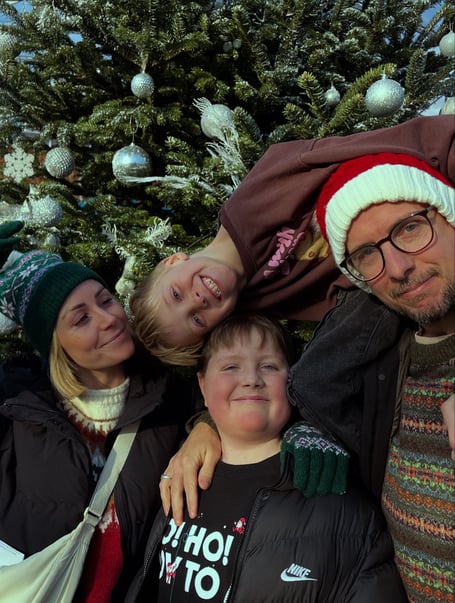 Rosie (left) with her son Rufus, her partner and younger son Noah