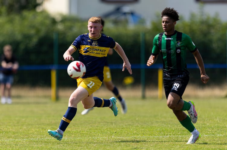 LLANTWIT MAJOR, WALES - 26TH JULY 2025:
Josh Jones of Llantwit Major in action against Calvin Smith of Aberystwyth.
Llantwit Major v Aberystwyth Town in the JD Cymru South at Windmill Lane on the 26th July 2025. (Pic by Lewis Mitchell/FAW)