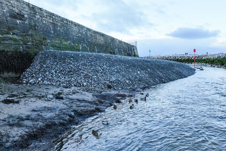 The mound is growing in height and stretches for over half the south pier.