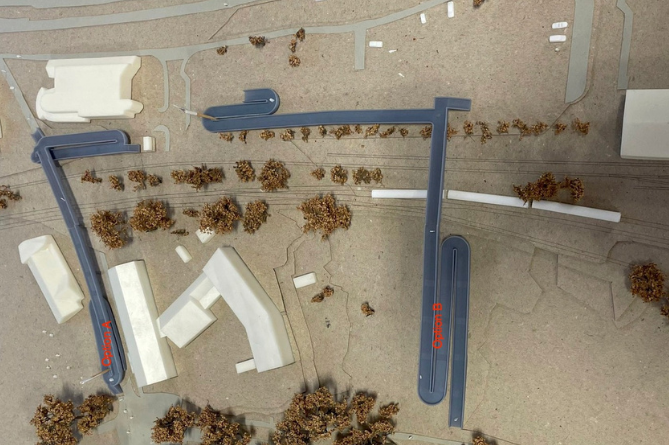 A 3D model on display at Ceredigion County Council offices in Aberystwyth shows Option A, by the rugby club, and Option B, directly over Plascrug School's play area
