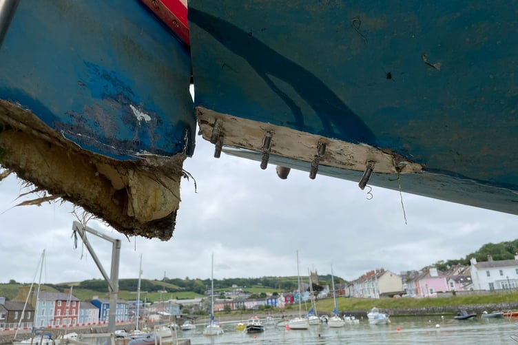 A 29-foot sailing boat was damaged beyond repair after it ran aground on Aberaeron's coastal defences during construction. Photo: Martin Vincent