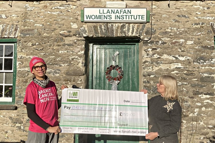 Adelle Robinson (left), accepting a cheque for £150 from Nicola Cronin, Llanafan WI’s Treasurer (right).