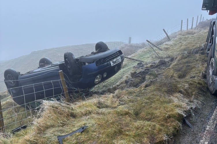 A car, overturned from a previous incident. Police state no injuries were reported for either incident.