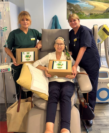 Patient Alyson Gayle Montinaro receives a wellness box at  Prince Philip Hospital’s Chemotherapy Day Unit