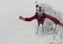 Tim Howell makes historic ski-BASE jump off Snowdon