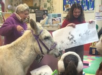 Donkey walks into a library and encourages new families to sign up