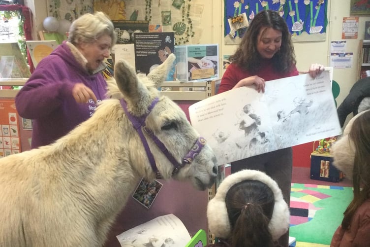 A donkey helped with a young readers project in Machynlleth library.