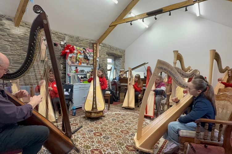 Cambrian Harp School students and harpists, Robin Huw Bowen and Gareth Swindail Parry