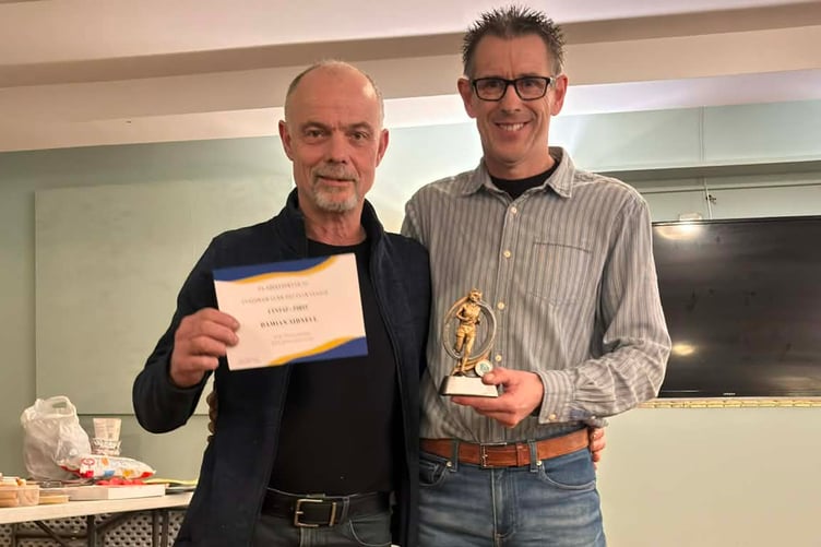 Damian receiving his club league award