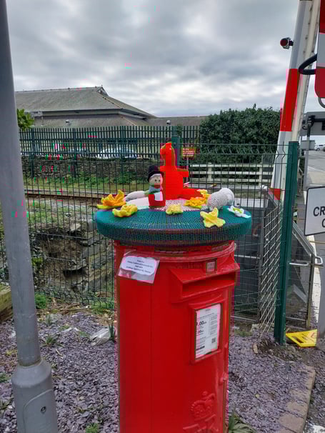 Barmouth WI's ‘Chatty Crafters’ created a special post-box topper for St David’s Day