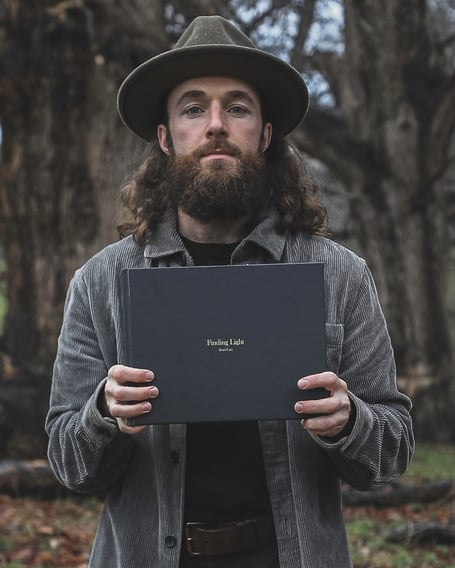 Brad Carr with Finding Light Book. Photo: Brad Carr