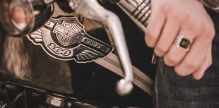 Police officers investigate alleged assault by Harley Davidson riders