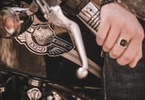 Police officers investigate alleged assault by Harley Davidson bike riders