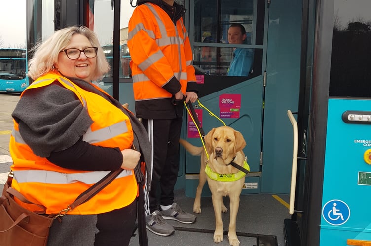 Bethan Sage Williams, North Wales Society of the Blind, with gyda Daniel Owen and his guide dog