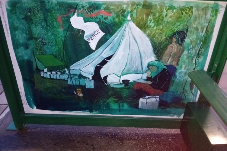 Who is the mysterious person who has beautified a bus stop in Aberystwyth?